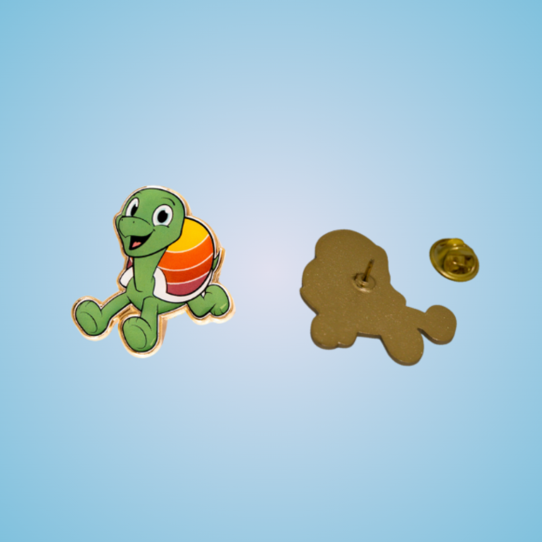 Picture displaying front and back of a custom made enamel pin with the company mascot